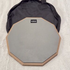 Snare practice drum, Vic Firth drumsticks, and a music stand